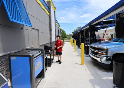 Car wash employee folding towels