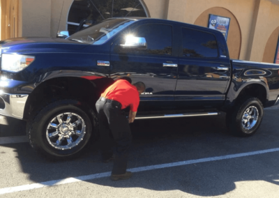 employee cleaning truck